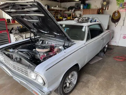 1964 Chevelle, hood open, in garage